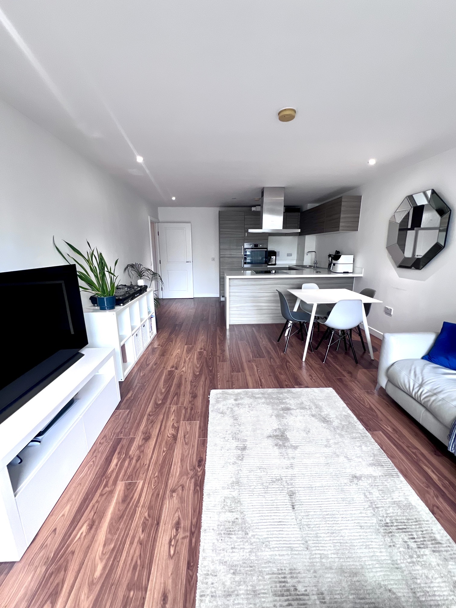 Dining area with kitchen beyond, Canary Wharf apartment
