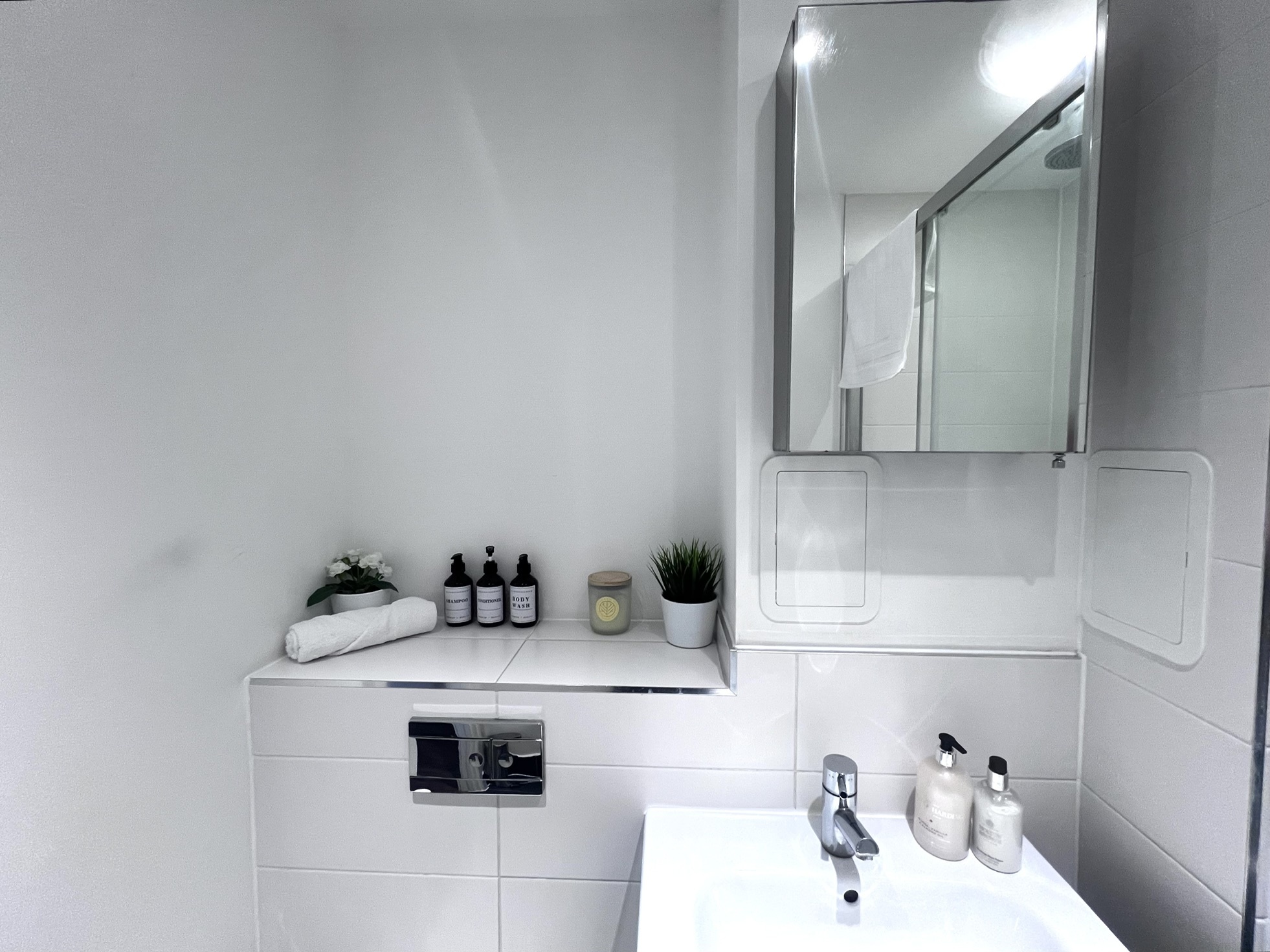 En-suite bathroom detail with fresh towels and toiletries